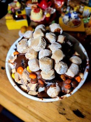 Cookie dough bites, peanut butter m&ms, Oreos, toffee, all covered in chocolate shell syrup.