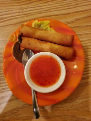 Thai Spring Rolls: Cabbage, glass noodles, and vegetables rolls served with sweet & sour sauce.