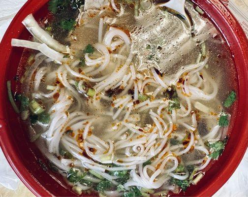 Pho with noodles and condiments