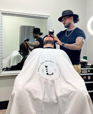 Beard treatment with hot towel and facial lotion.