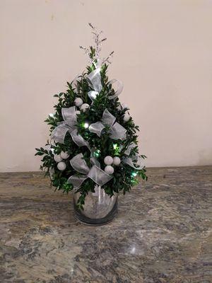 Boxwood and centerpiece arrangements for company holiday party.