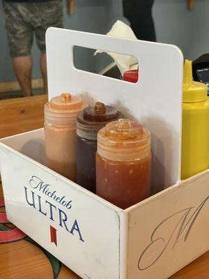 Table condiments including fry sauce, bbq sauce, and sweet chili sauce!