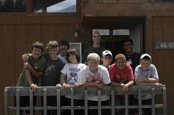 Campers in front of their cabin at Camp Chief Ouray