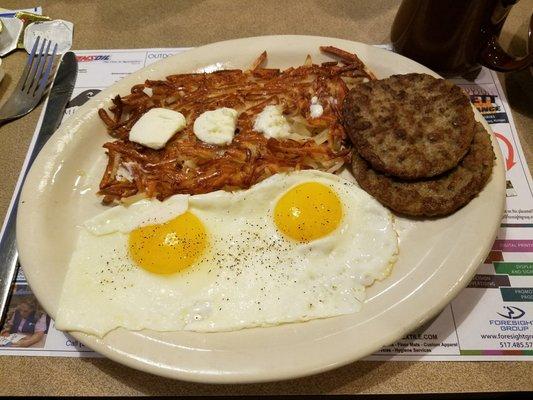 2 eggs sunny side, hash browns and sausage patties.