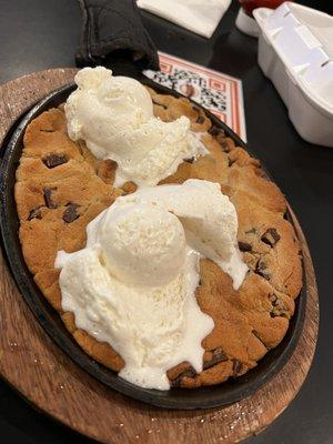 Skillet cookie. It looks so good but the cookie layer is super thin so you get more ice cream than cookie