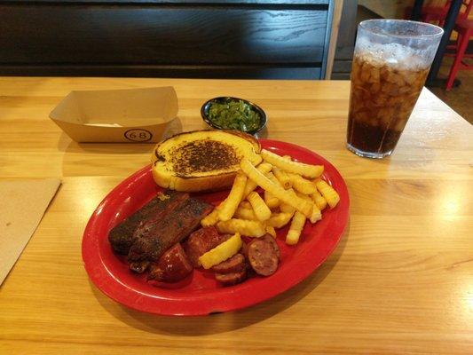 Ribs with dry rub, jalapeno cheddar sausage, fries, green beans, and garlic bread.