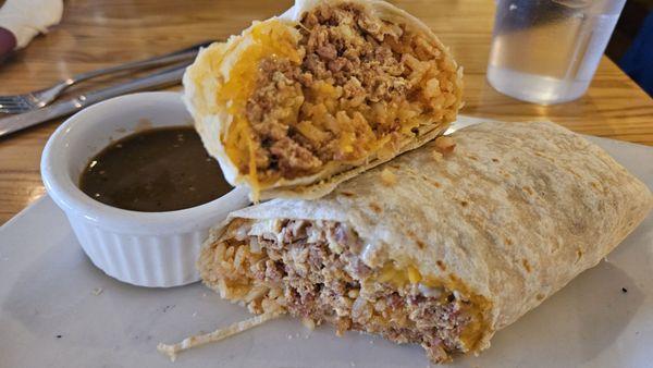 Custom breakfast burrito with chorizo, eggs, rice, and mixed cheese. Decent. A bit mushy. Maybe add in some crispy hashbrowns.