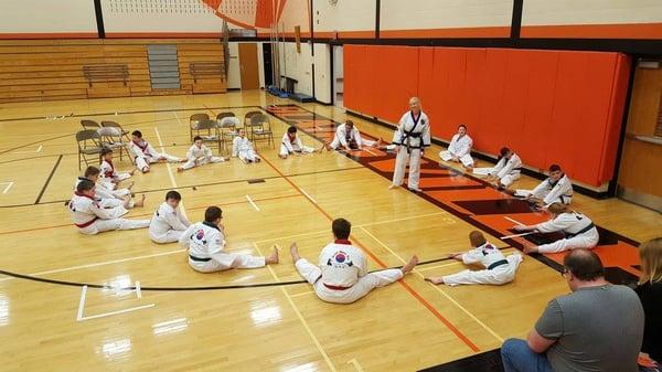 Stretching out before the tournament competition begins.