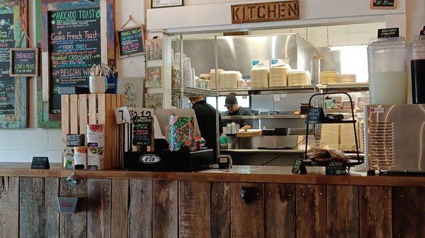 Counter area with view of kitchen