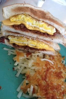 Bacon egg and cheese breakfast sandwich with home fries $7.50