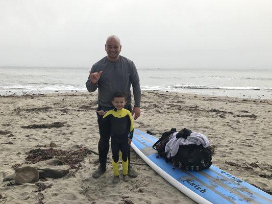 Mike and son Nico after the Paddle Out Ceremony for the Maverick's Contest with the local Boys and Girls Club kids.