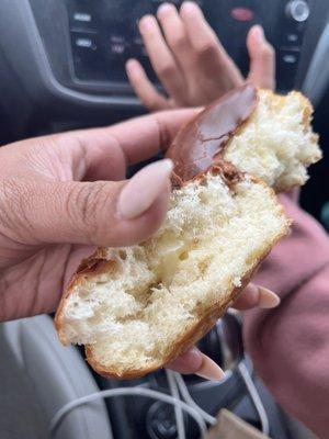 Chocolate filled donut with pea size serving of custard. I split in half to share with my daughter and this is what was in the middle.