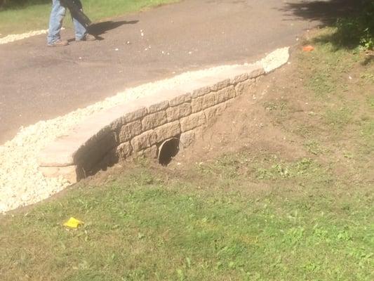 Here, we wrapped the sides of a driveway to get rid of a tough to maintain area.