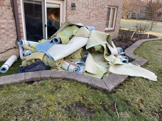 Damaged carpeting was removed by Junk Bee Gone...