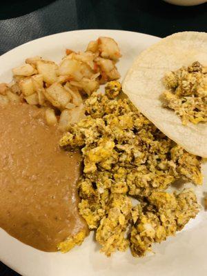 Huevos Con Chorizo plate with corn tortillas.