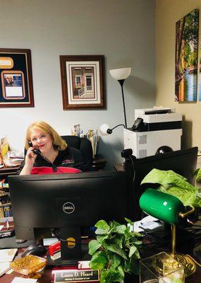 Laura D. Heard at her desk