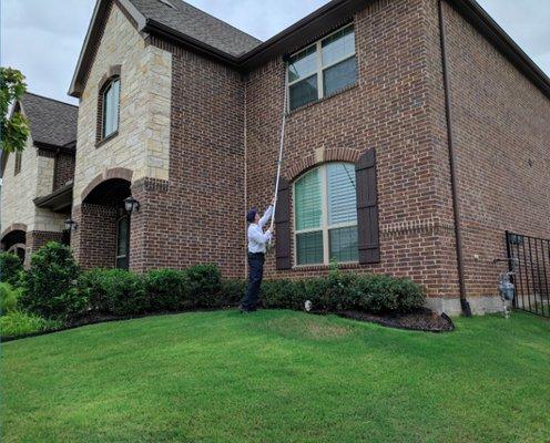 Field experts use a 30-foot web pole on every visit to sweep the eaves and windows of your home, removing spider webs and wasp nests.