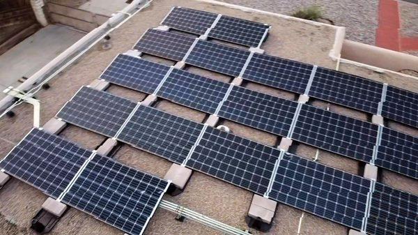 Flat roof install with no penetrations on New Mexico's famous Tar and Gravel roofs!