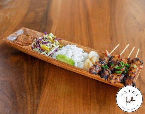 Chicken Saté Plate, served with white rice, krupuk (shrimp chips), indo slaw w/ curry-serrano dressing, peanut sauce, and sambal chili paste