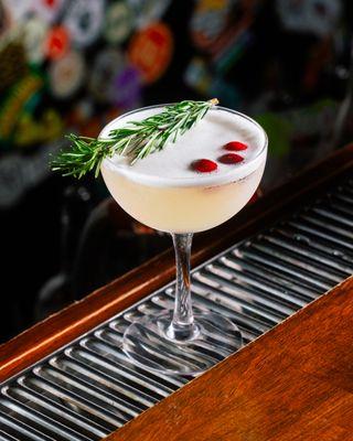 The White Christmas Cosmo made with
Lavender Infused Vodka, Triple Sec, Lime Juice, Lavender Syrup, White Cranberry & Peach Juice!