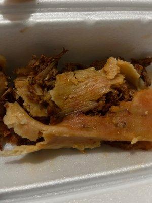 I tried to move it and it completely crumbled apart in a wet mushy mess. I love tamales but this was unbearably bad.