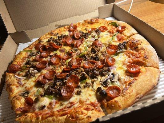 One of their specialty pizzas with green pepper, black olive, mushroom, pepperoni, and sausage. Absolutely delicious.