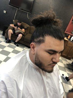 Tapper fade with a man bun...faded beard