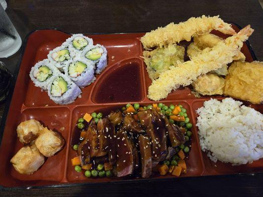 Teriyaki steak, shrimp and vegetable tempura, California roll and shumai.