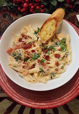 Chicken and spinach in a cream sauce of sundried tomatoes and bacon.