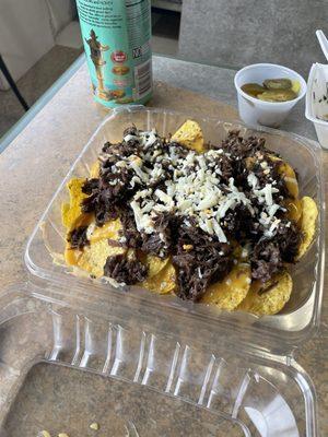 Nachos supreme and barbacoa cowboy burrito.