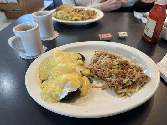 Garden omelette in background and portobello Benedict in foreground.