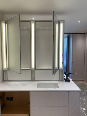 Double sided vanity with mirror lighting