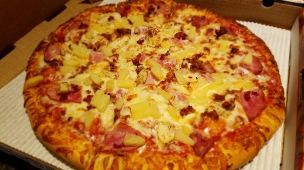 Great flavors of Ham, Bacon, Pineapple, and Chicken with the Hawaiian Pizza!