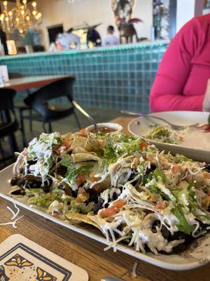 Nachos - after we started devouring them. There was lots of guac, chicken, toppings galore!