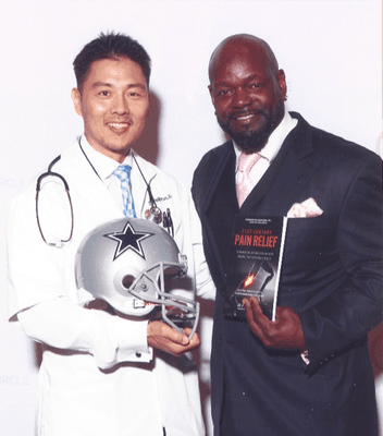 Dr. Yoo & Emmitt Smith with Dr. Yoo's best selling book "21st Century Pain Relief"