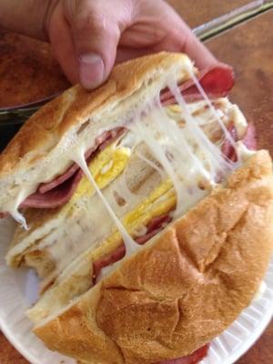 2 eggs ham and mozzarella on a roll