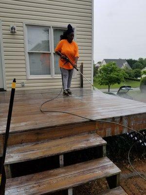 Look at our Handywomen Go get your deck pressure washed and stained