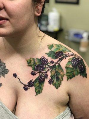 Realistic and detailed blackberry tattoo