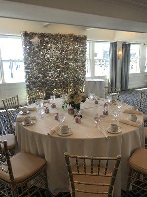 Flower Wall and wrapped favors on table