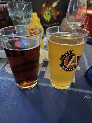 An Amber beer next to a Wheat Sam Adams.