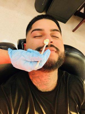 Doing nostril wax