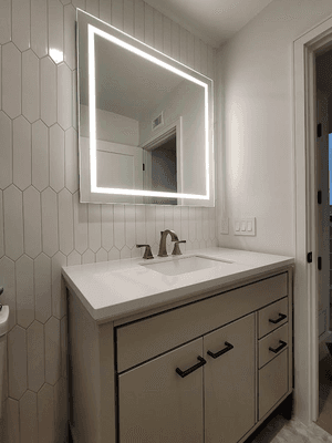 Backlit modern style vanity.