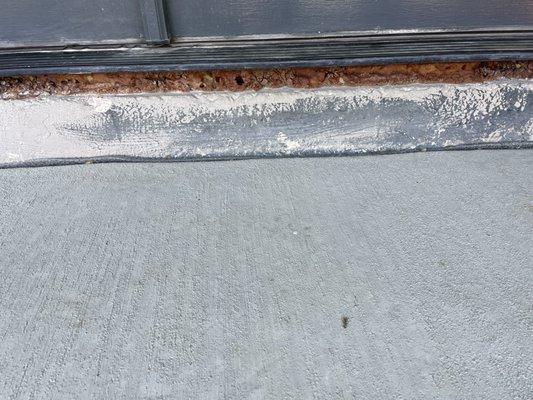 Under door frame when old concrete was demolished.