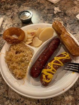 SauerKraut, German Potato Salad, Pretzel Roll, All Beef Frank, KrainerWurst, Beer Battered Onion Ring