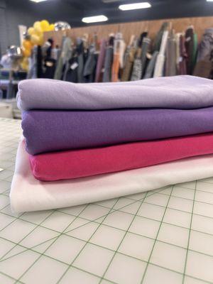 Cotton jersey solids on the cutting table. 7.5 oz , two way stretch t-shirt knits. 100% cotton, Milled in Los Angeles Ca.