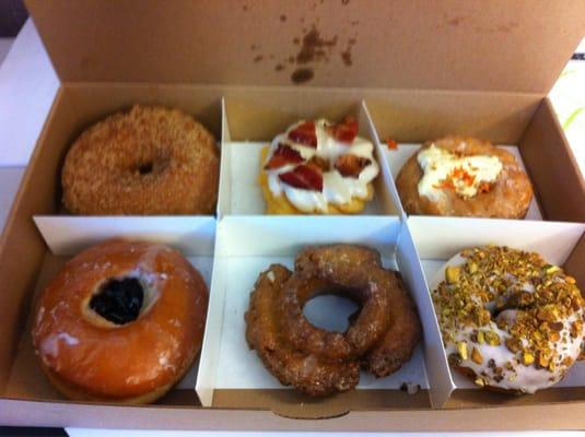 from top left: cinnamon crunch, maple bacon, carrot cake, pistachio, old fashioned & their take on PB&J.