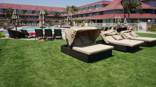 Artificial grass is low maintenance around the pool area.