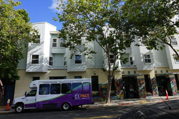 View of the building with a PACE bus in front.