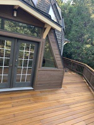 Semi transparent stain on deck.solid base stain on railing and entire exterior of cabin