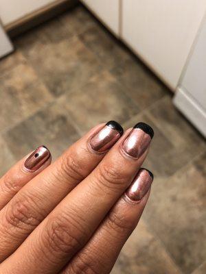 The pic is of my chrome nails. The black you see is not a fun design but rather the base color. The base color showed the same day :(